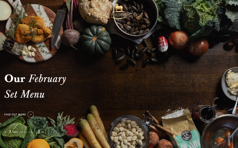 Various food items—roasted chicken, vegetables, mussels, and gnocchi—are arranged on a dark wooden surface. The arrangement advertises a February set menu.