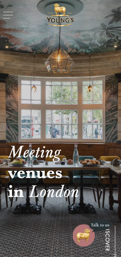 A meeting room, arranged with a table and chairs, is shown in a London pub. The text overlay reads: "Meeting venues in London". A small logo with a ram's head is visible in the bottom right, next to "Talk to us" and "DISCOVER".